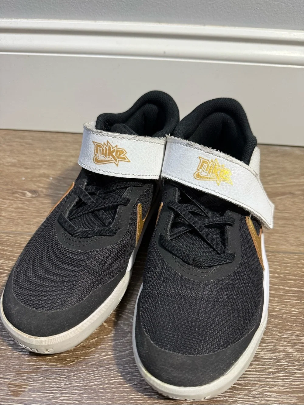 Nike Kids Black, White and Gold Velcro Strap Sneakers